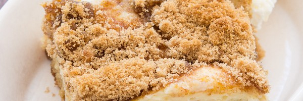 This Cheesecake Swirled Brown Sugar Cake is devilishly moist, filled with plump raspberries and blackberries, then topped with a creamy cheesecake swirl and a crisp brown sugar crumble.