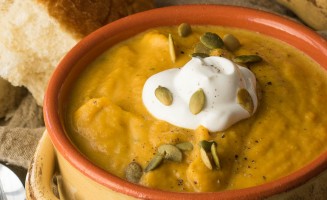 This Creamy Pumpkin and Acorn Squash Soup is the perfect recipe to warm up on a cold winter's night! I love the roasted pepitas on top!