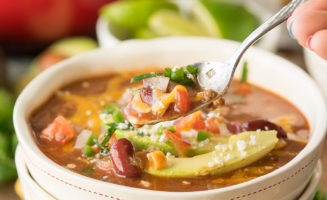 This Quick and Easy Taco Soup recipe is a family favorite! We love topping it with all the taco toppings!