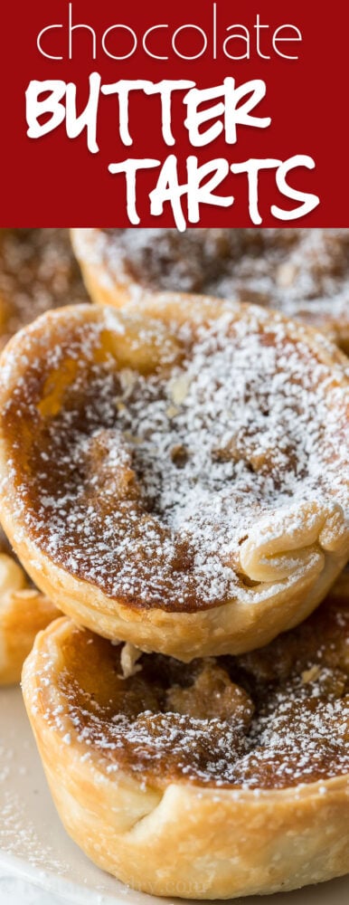 These delicious Chocolate Butter Tarts are filled with walnuts and topped with powdered sugar.